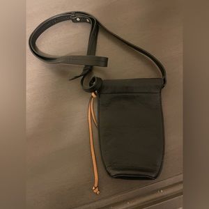 Lucky Brand. Used a couple times. No notable flaws. Leather.